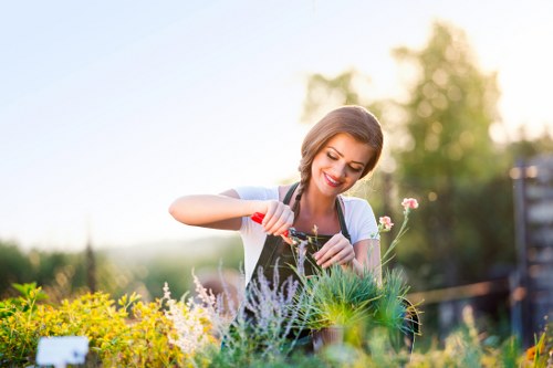 Gardener wearing PPE and demonstrating safe work procedures