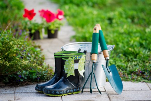 Gardener pruning plants in a Chigwell residential garden